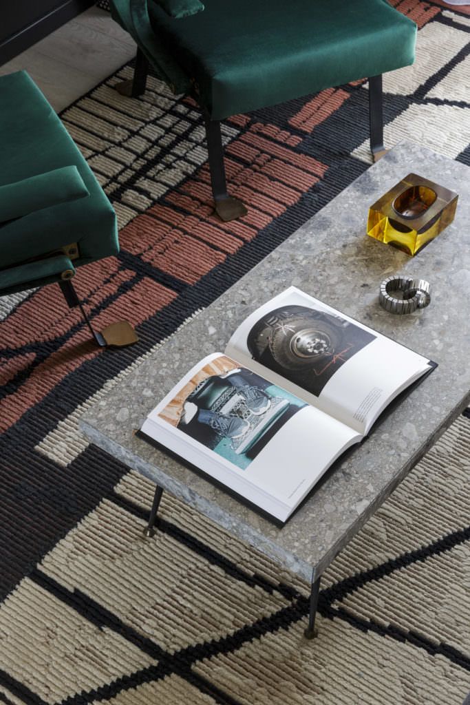 Green velvet Gardella Digamma armchairs and Spinzi Origini stone coffee table